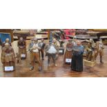 A quantity of early 20th century carved wood Austrian souvenir figures