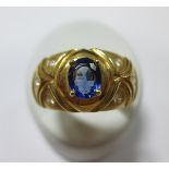 A tanzanite and diamond ring, the tapered convex band set to the centre with an oval cut tanzanite