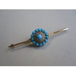 A Victorian turquoise and diamond bar brooch, set with a circular flower motif with a central and an