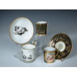 Two Vienna coffee cans and saucers and a German can, the first painted in black with figure by a