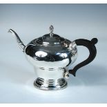 A silver tea pot, by Barker Ellis Silver Co, Birmingham 1975, of plain inverted pear shape with