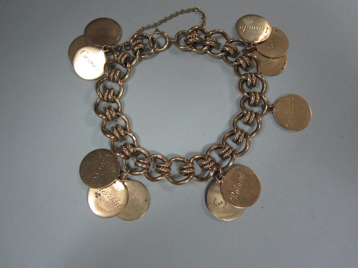 A 9ct gold fancy link bracelet suspending fourteen name discs, each 1.6cm disc engraved with a