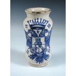 An 18th century blue and white drug jar, possibly Spanish, the waisted cylindrical shape painted