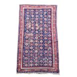 A large Caucasian blue ground rug, possibly Karabagh 402 x 204cm (157 x 80in)  Low pile and worn