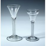 Two air twist wine glasses, one with a pan topped bowl, 14.5cm (5.75 in) high and the other with