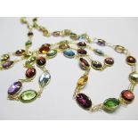 A multi gemset necklace, designed as a chain of fine double links alternating with oval and round