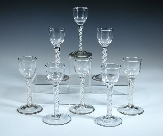 A set of eight 18th century opaque twist glasses, the slightly tapering cylindrical bowls on