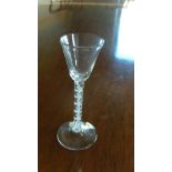 An 18th century opaque twist wine glass, the conical bowl on double helix stem and circular foot,
