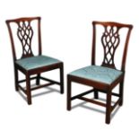 A pair of George III mahogany dining chairs, with pierced splat backs and drop in seats 94 x 53cm (