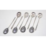 A group of eight Russian silver teaspoons, with niello decorated fig shaped bowls and twisted gun