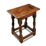 A 17th century oak joint stool, on baluster turned legs 52 x 46 x 27cm (20 x 18 x 11in)  Old
