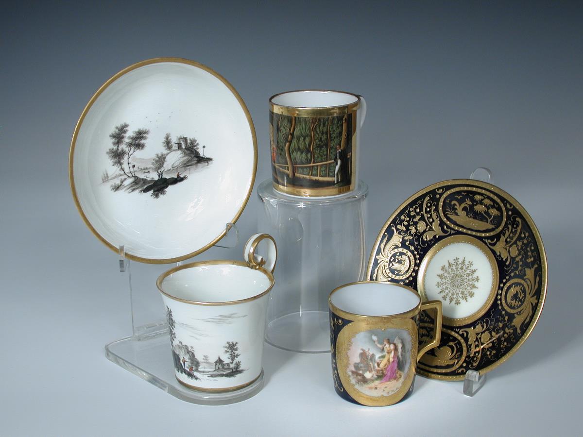 Two Vienna coffee cans and saucers and a German can, the first painted in black with figure by a - Image 2 of 3