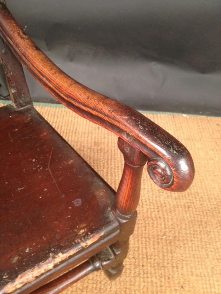 A Carolean oak armchair, with shaped crest rail, turned rail and slat back, scrolling arm - Image 4 of 6