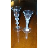 Two 18th century air twist wine glasses, one with bell bowl on double knopped stem and circular