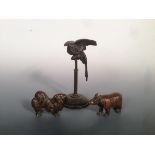 A Bergman type bronze parrot, a rhinoceros and a spaniel, the bird chatting from its perch, 11cm (