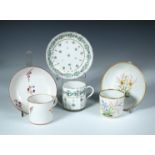 Attributed to Pinxton, three coffee cans and saucers, one painted with a 'Hyacinth' and a 'Jonquil',