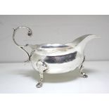 A small George II silver sauce boat, Charles Chesterman, London 1752, of plain oval shape with cut