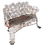 A small 19th century cast iron garden seat, with fruiting vine decoration to the back, legs and