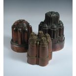 Three Victorian castellated copper jelly moulds, one struck with orb mark and numbered 469 (3)