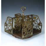 A late 19th century Art Nouveau rosewood and brass revolving table top bookstand, the brass