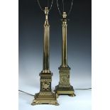 Two gilt metal cluster column table lamps and shades, each with four columns flaring to rosette cast