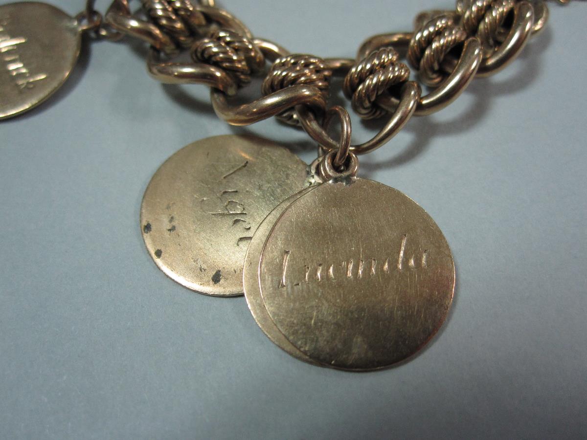 A 9ct gold fancy link bracelet suspending fourteen name discs, each 1.6cm disc engraved with a - Image 2 of 3