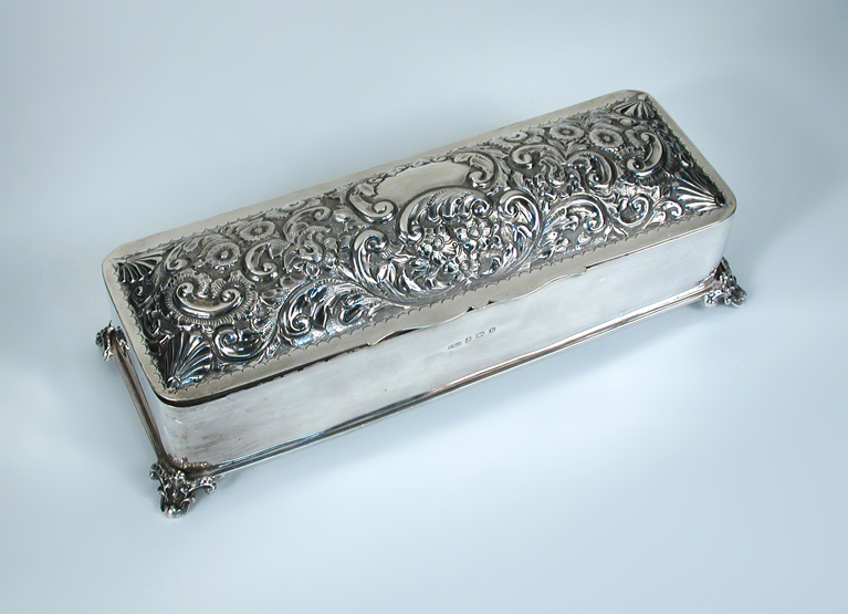 An Edwardian silver dressing table or glovebox, by T H Hazlewood & Co, Birmingham 1907, the plain