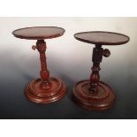 A 19th century fruitwood candlestand and another in rosewood, the dished circular tops adjustable in