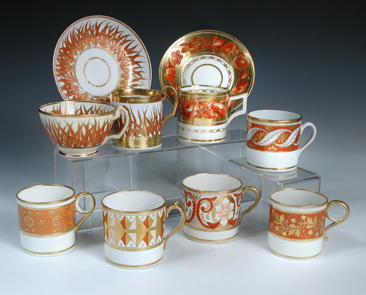 Ten Regency coffee cans decorated in a similar palette, all with orange and gilt painted patterns, - Image 2 of 3