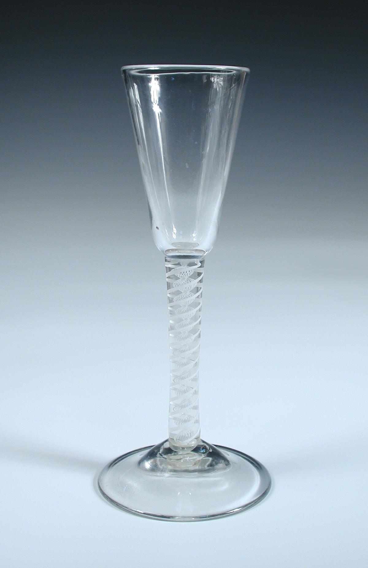 An 18th century opaque twist wine glass, the slender conical bowl on double helix stem and - Image 2 of 3