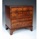 A 19th century miniature mahogany chest of drawers, the rectangular top with reeded edge above two