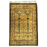 A small Kashmir silk prayer rug, India, decorated with hanging lanterns 97 x 61cm (38 x 24in)