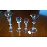 Four 18th century wine glasses, the air twist with bell bowl applied knop and circular foot, 18cm (7