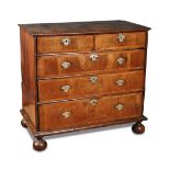 A William and Mary walnut chest of drawers, drawer fronts with banded border decoration, engraved
