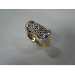 An 18ct gold bi-coloured ring by Salvatore Bersani, the chunky design with a white gold tubular mesh