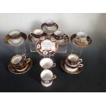 Eight early 19th century coffee cans and saucers, some with additional cups, all decorated with blue