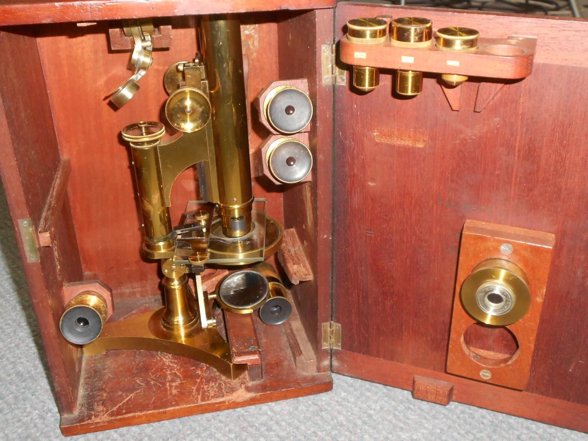 A 19th century lacquered brass binocular microscope by R & J Beck, London and Philadelphia no.11786,