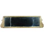 A gilt framed overmantle mirror, early 18th century with triple bevelled plate, gesso moulded leaf