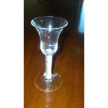 An 18th century opaque twist wine glass with bell bowl, the stem on circular foot, 17cm (6.75 in)