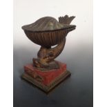 A 19th century ormolu and marble ink stand, the hinged scallop shell cover opening to reveal ink