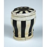 An early 19th century ivory and ebony box, the oval lid with white metal hinge and monogrammed oval,