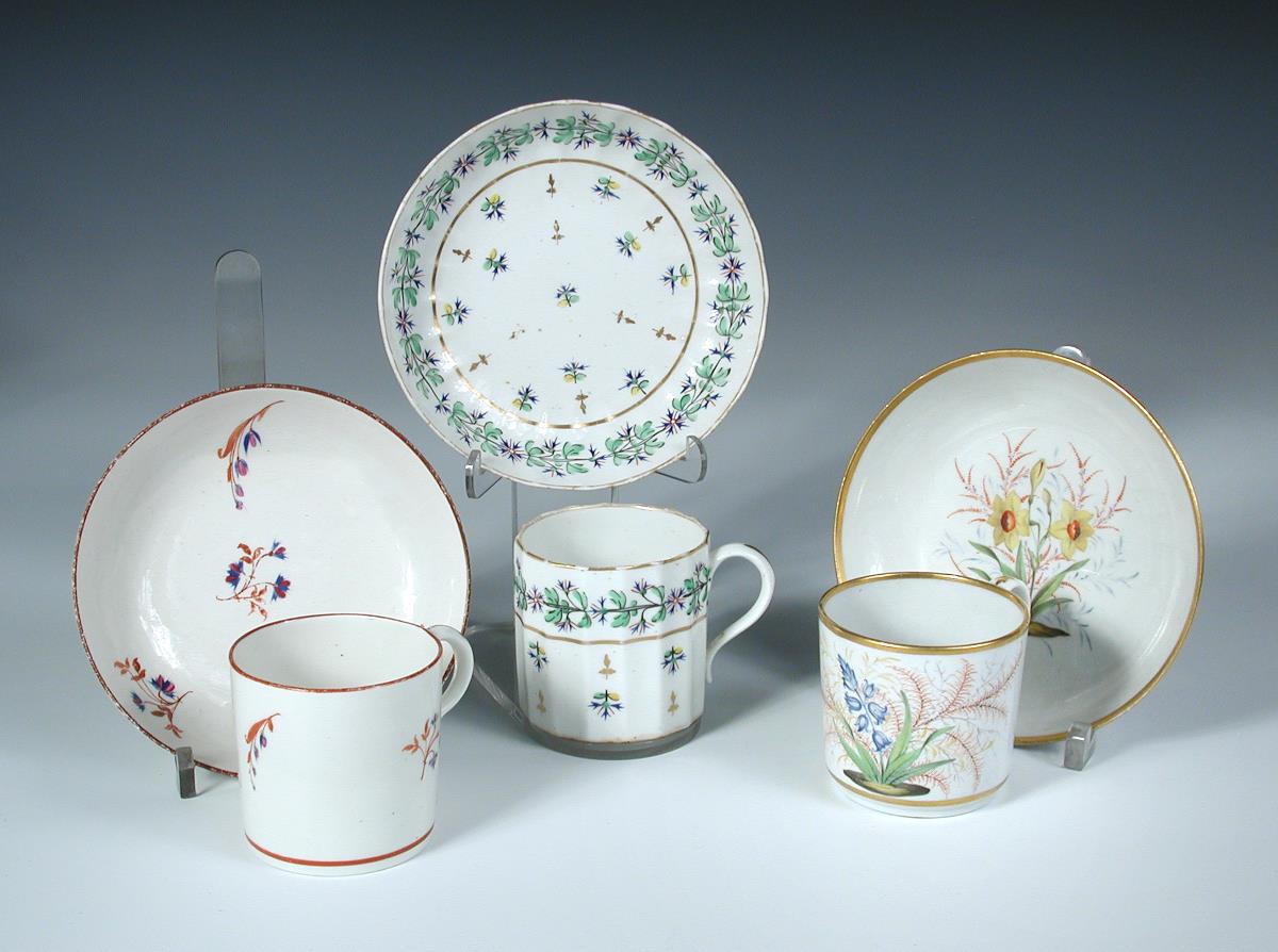 Attributed to Pinxton, three coffee cans and saucers, one painted with a 'Hyacinth' and a 'Jonquil', - Image 2 of 2