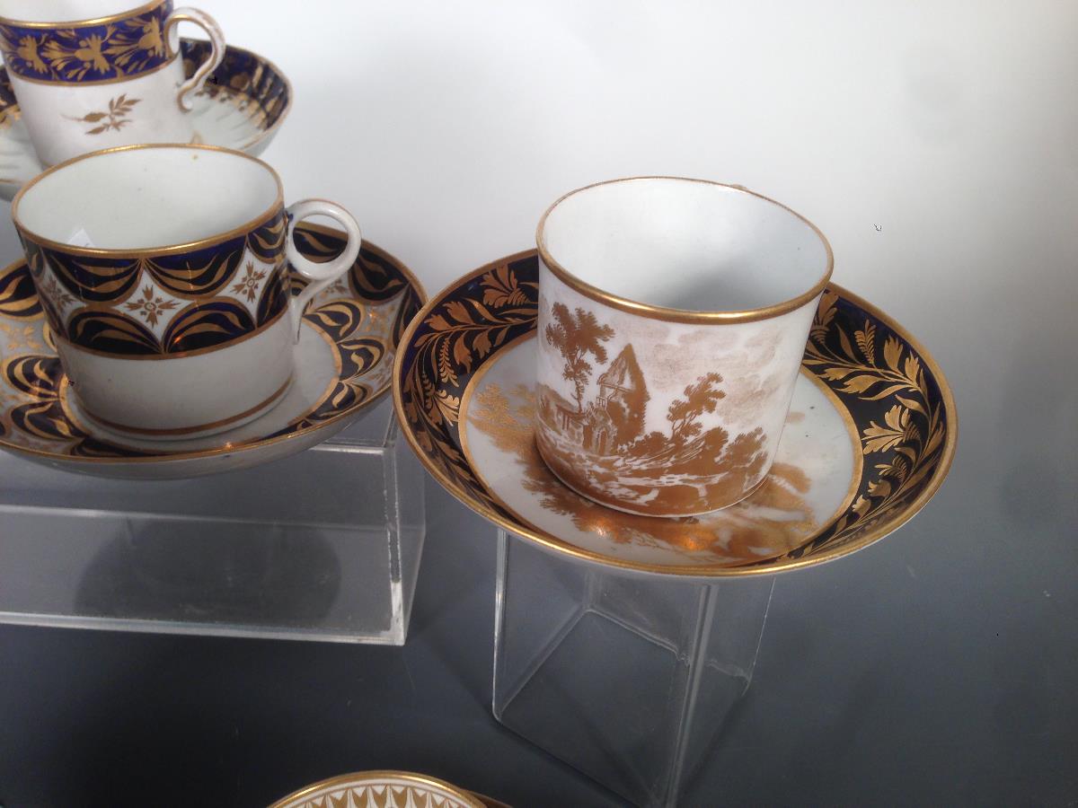 Eight early 19th century coffee cans and saucers, some with additional cups, all decorated with blue - Image 2 of 4