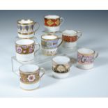 Eight Regency coffee cans, each with banded decoration and gilt highlights, including examples by