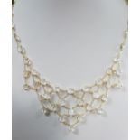 A moonstone bib necklace, designed as a fine chain spectacle set all along with oval cabochon