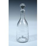 A Lynn glass decanter with teared stopper, the neck and shoulders plain, horizontal rings on the