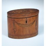 A late 18th century marquetried satin wood tea caddy, the oval top inlaid with a basket of fruit