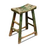 An 18th century elm primitive stool, traces of green paint 54 x 36 x 22cm (21 x 14 x 9in)  Extensive
