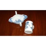 An 18th century Worcester blue and white double lipped sauce boat and a mug, the rococo moulded