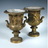 A pair of 19th century gilt bronze urns and zinc liners, the sides of the two handled campana shapes